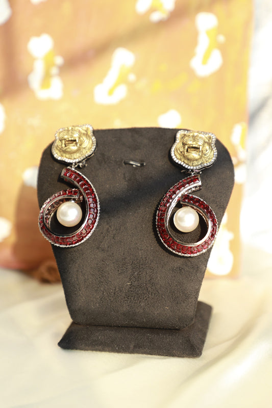 Lion faced pearl drop earrings