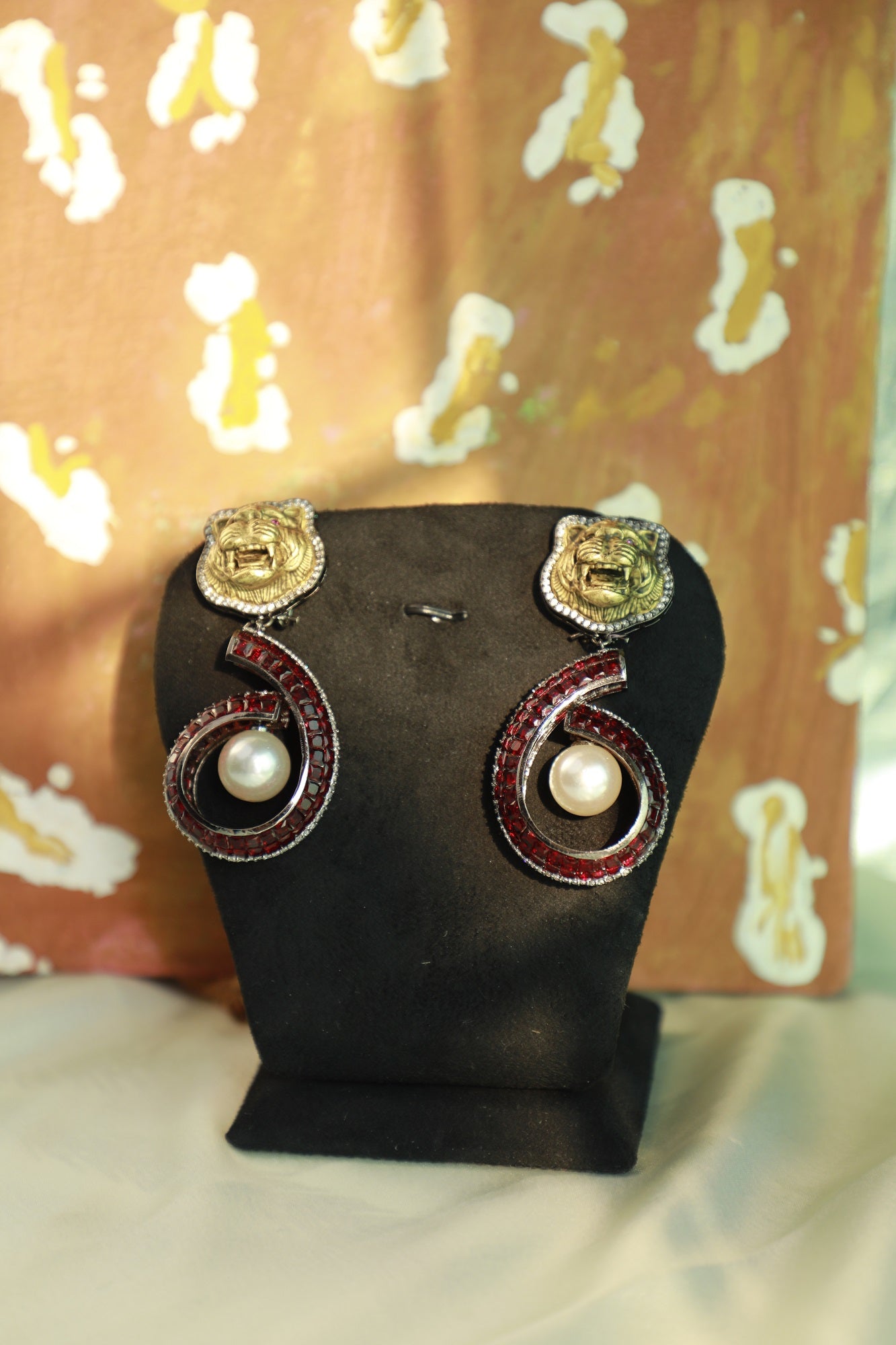 Lion faced pearl drop earrings