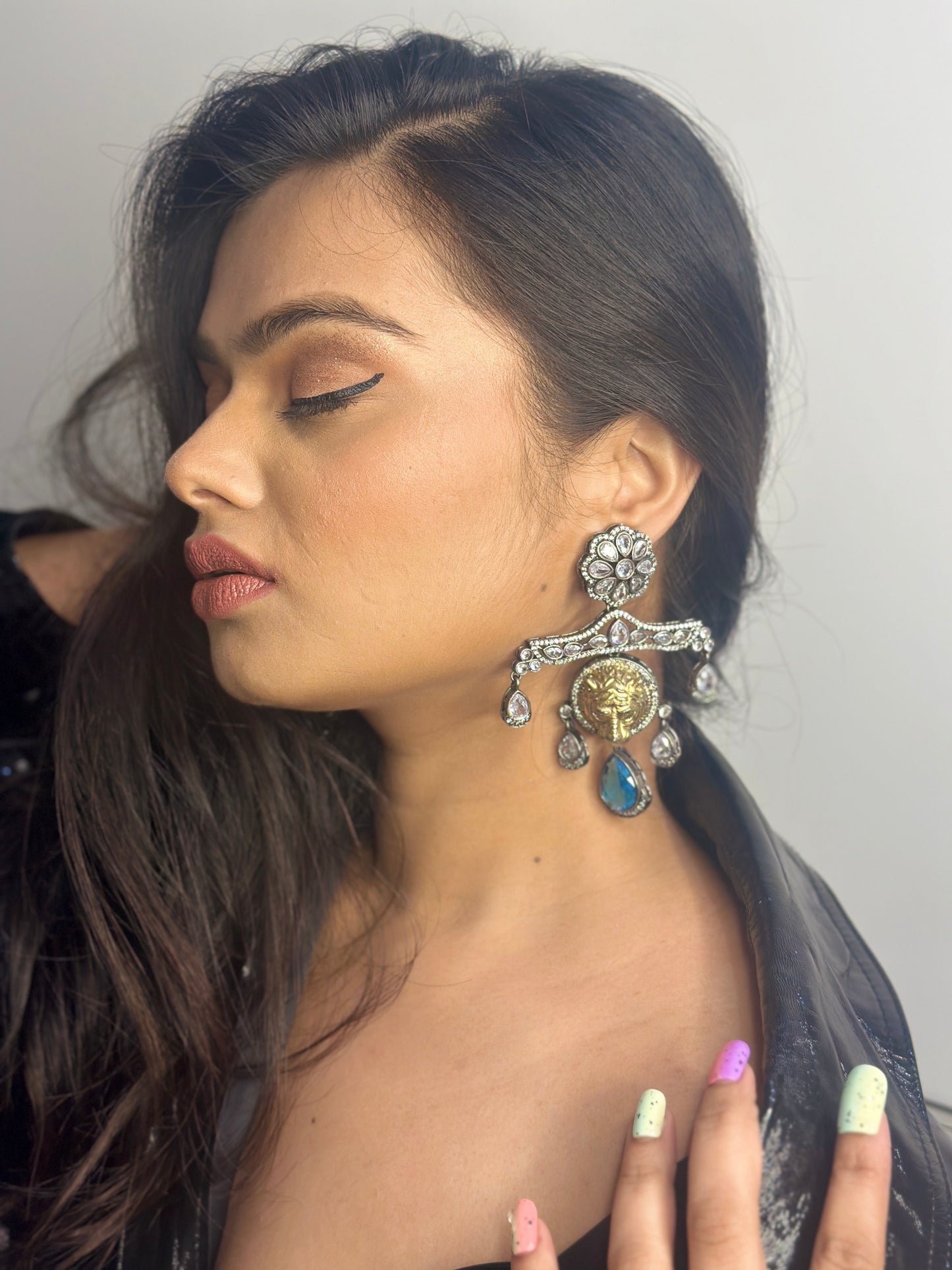 Golden Lion Faced Earrings With Crystal Blue Tear Drop